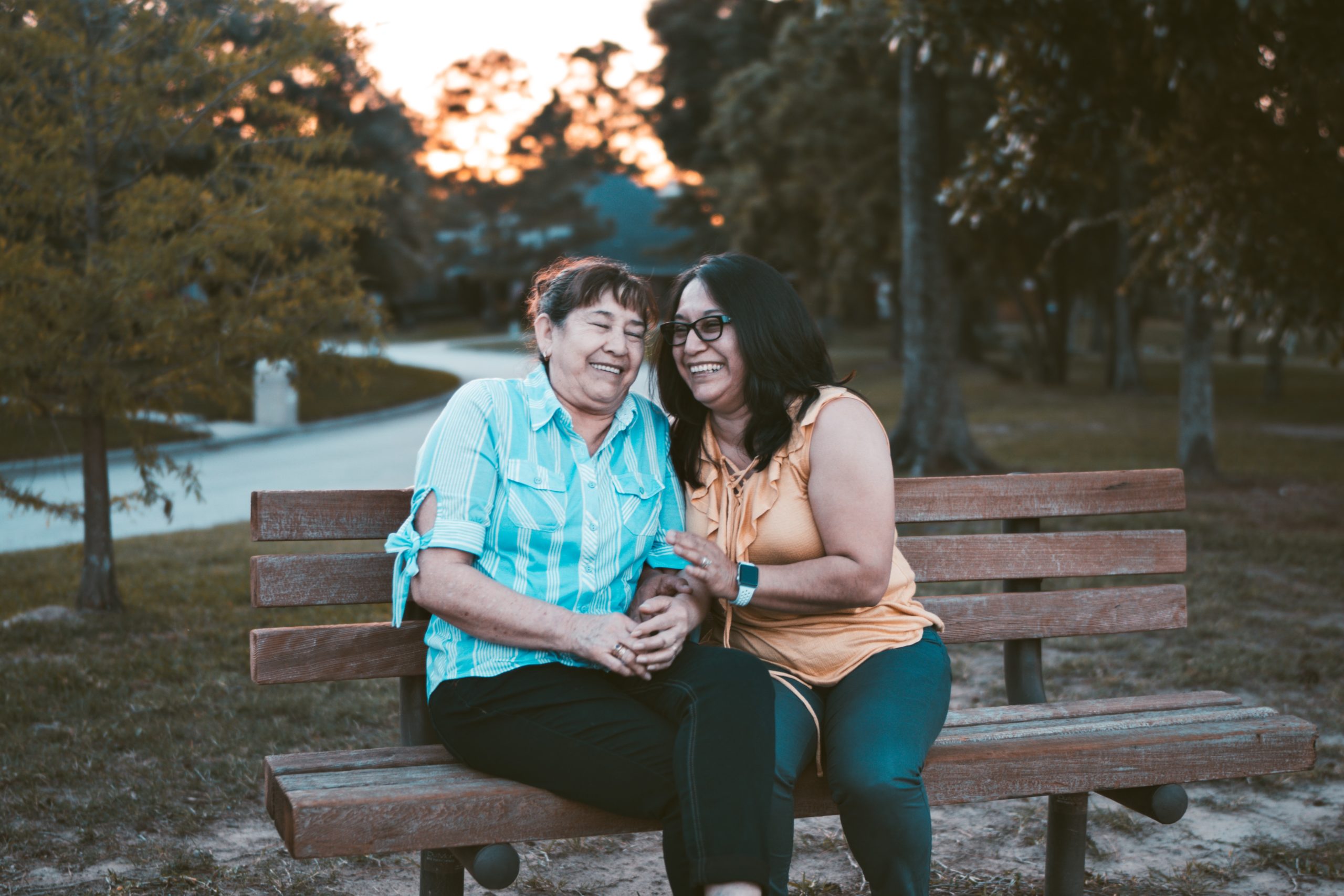 Fatigue is a common symptom for people with cancer. Learn how to combat the symptoms. Image of two women sitting on a park bench.